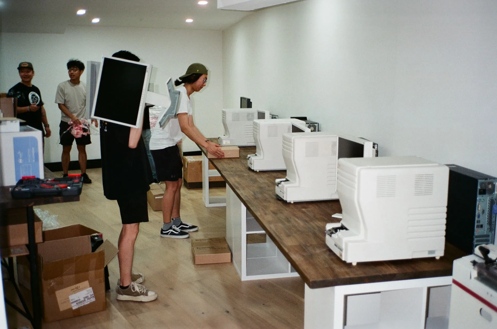 The team setting up the Sydney lab, lining scanners up along a long bench